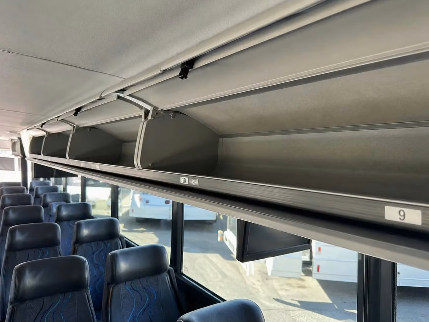 kingman 56 passenger charter bus overhead storage